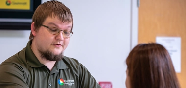 man standing at desk
