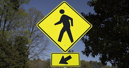 pedestrian crossing road sign