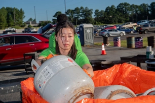 volunteer disposing of hazardous materials