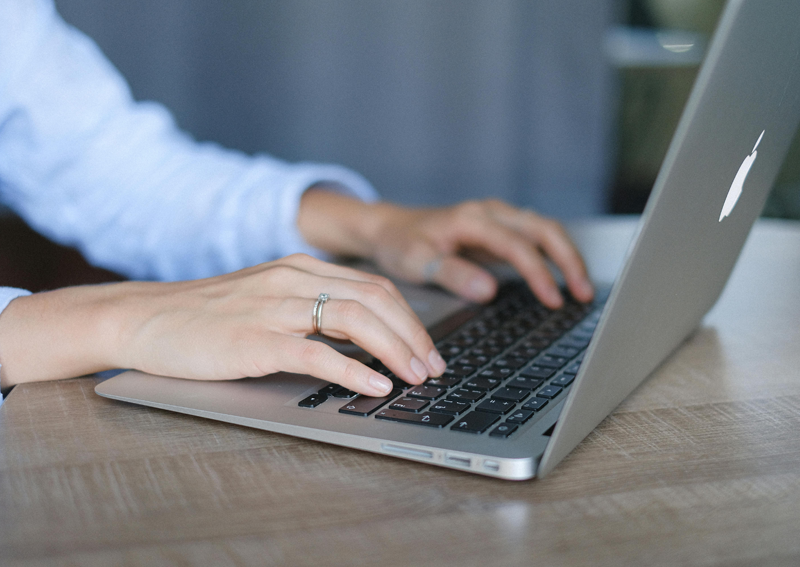 close up of person using laptop