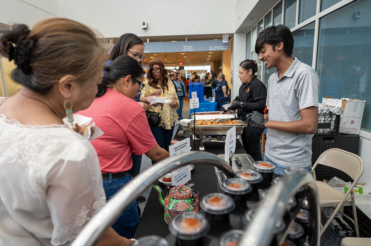 Attendees trying typical food