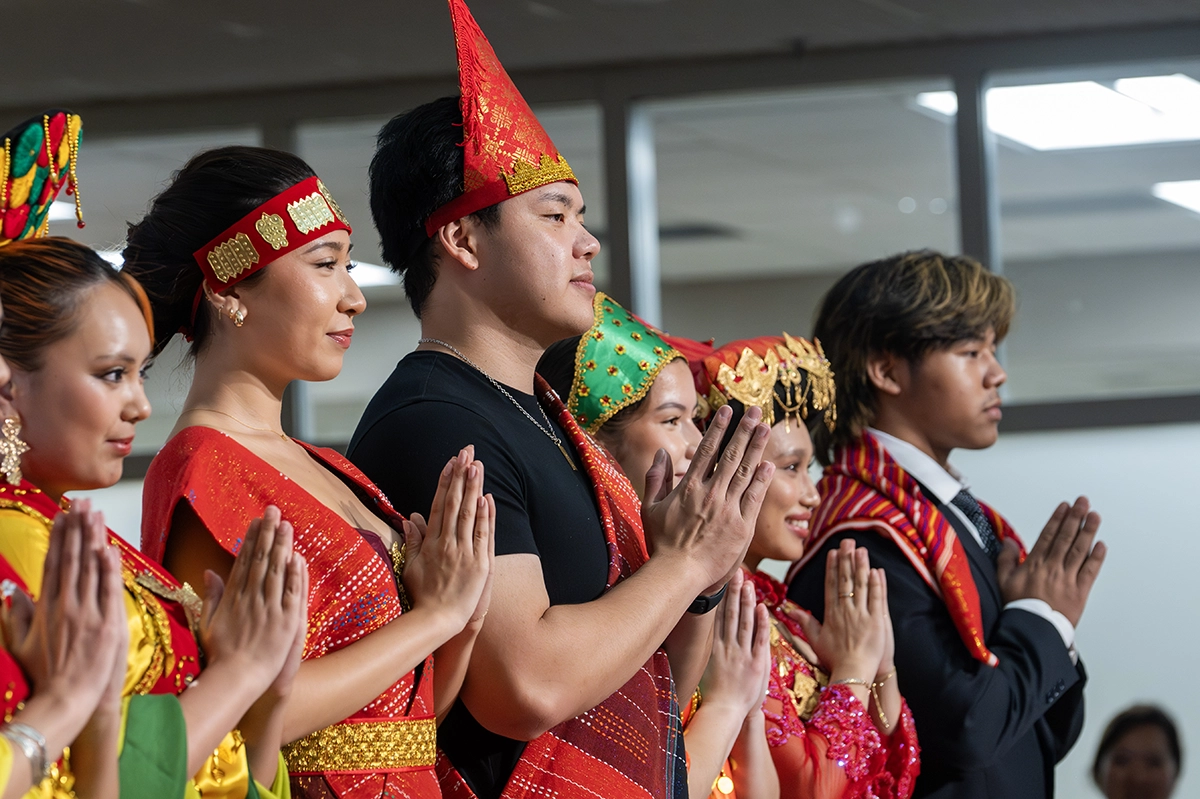Group of performers saluting together