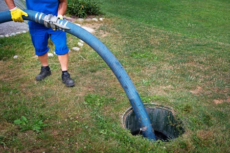 county worker working on storm drain