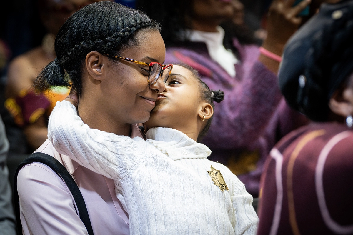 Mother and daughter in the audience hugging