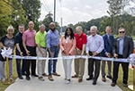 Gwinnett officials and city leaders cut ribbon on Spalding Drive widening project