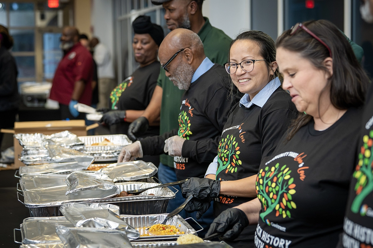 Volunteers helping serve the food