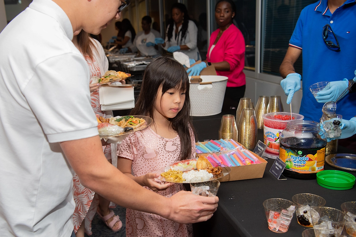 People tasting traditional AAPI food