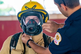 gwinnett county firefighter putting on equipment