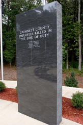 Granite marker honoring Gwinnett County employees killed in the line of duty