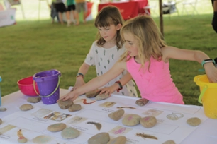 young girls with art and crafts project at water wonders spring festival
