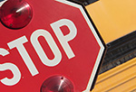 School has resumed so don't pass stopped buses and watch for kids at bus stops